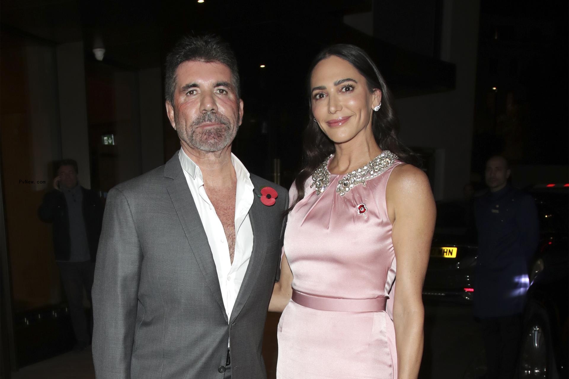 Simon Cowell and Lauren Silverman arrive for the Shooting Star Ball at the Royal Lancaster Hotel on November 11, 2022 in London, England.