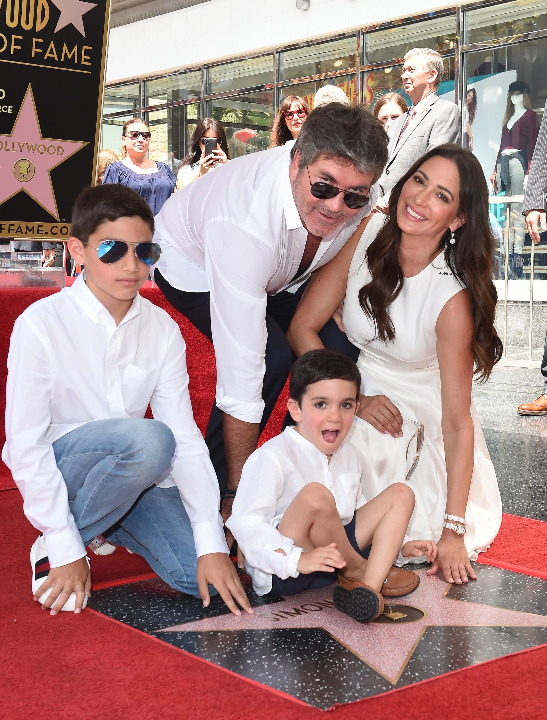 Simon Cowell, Lauren Silverman, Eric Cowell and Adam Silverman attend the ceremony ho<i></i>noring Simon with star on the Hollywood Walk of Fame on August 22, 2018 in Hollywood.