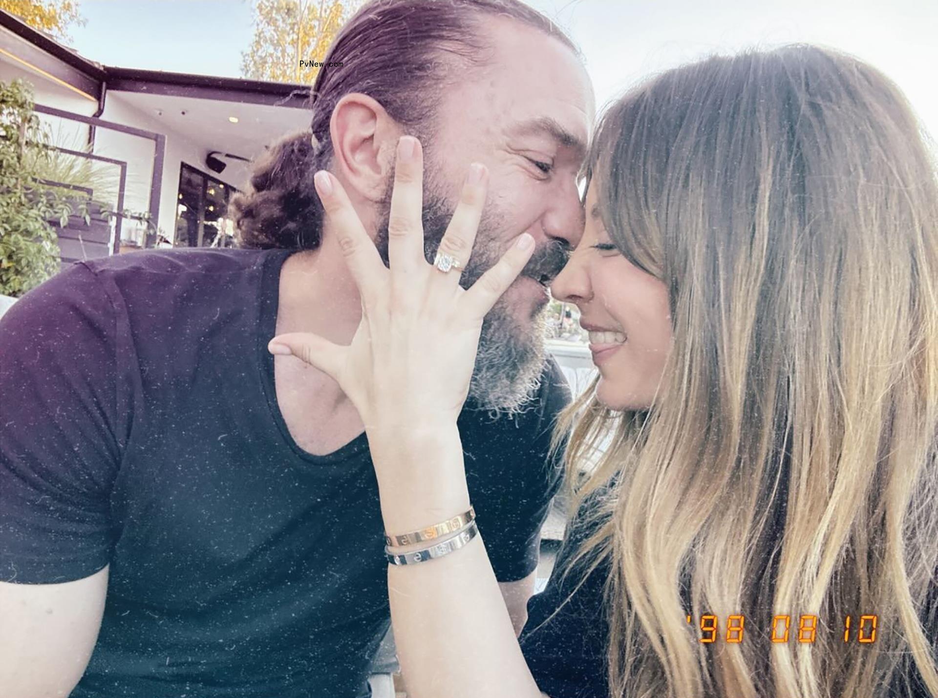 kaley cuoco showing her engagement ring in front of tom pelphrey's face