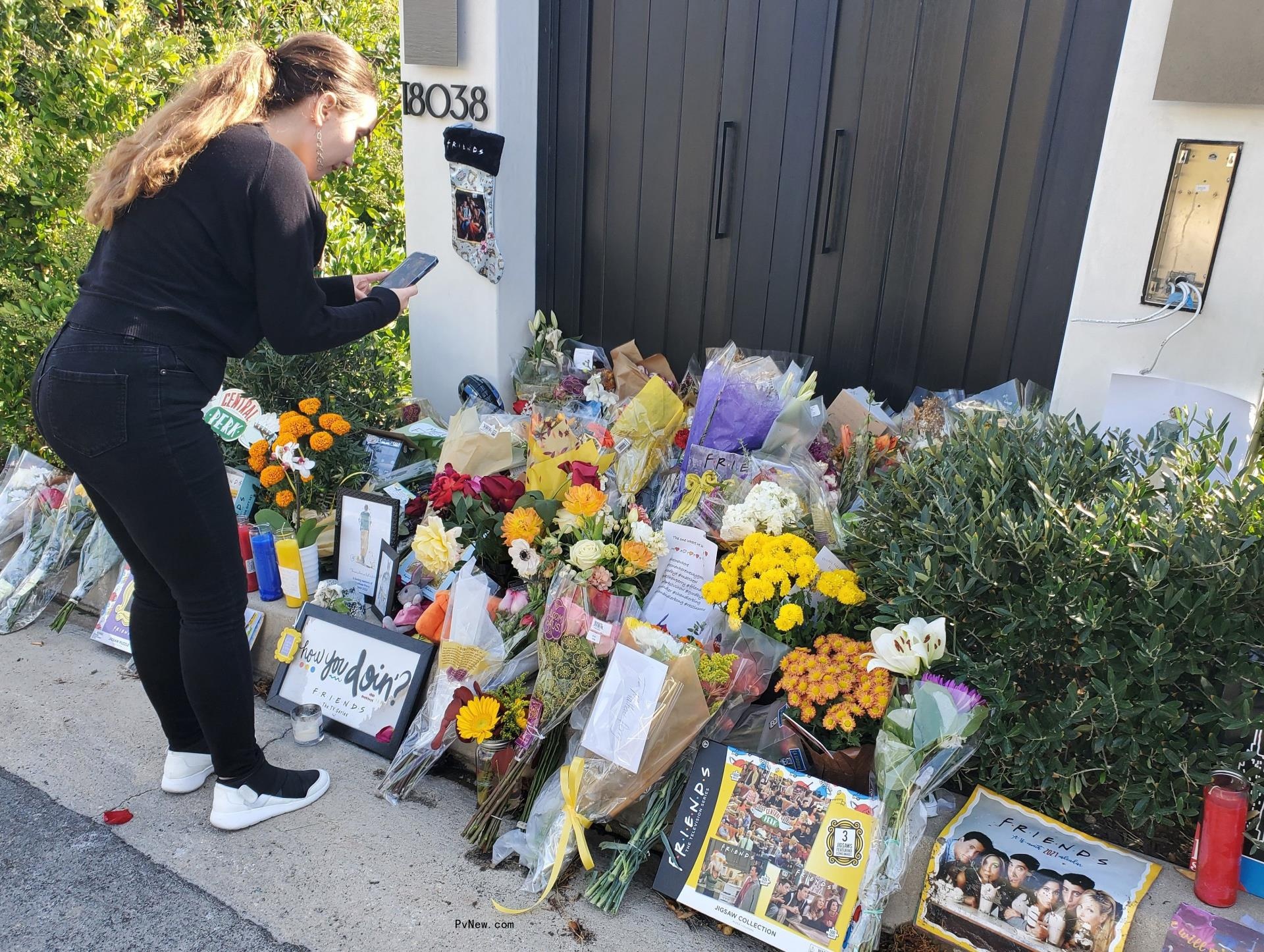 Fans leaving flowers at Matthew Perry's home.