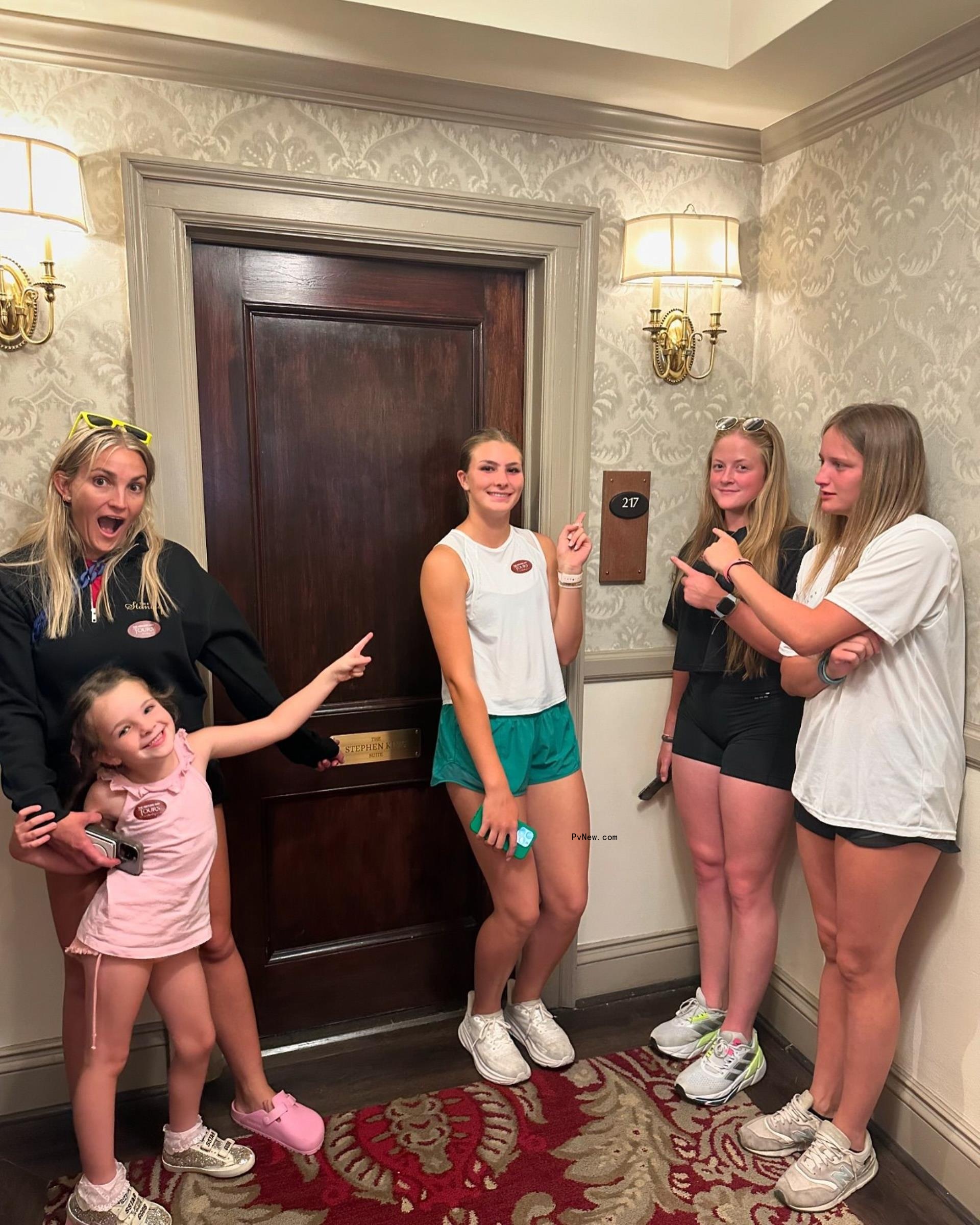 Jamie Lynn Spears with her daughters outside of a hotel room.