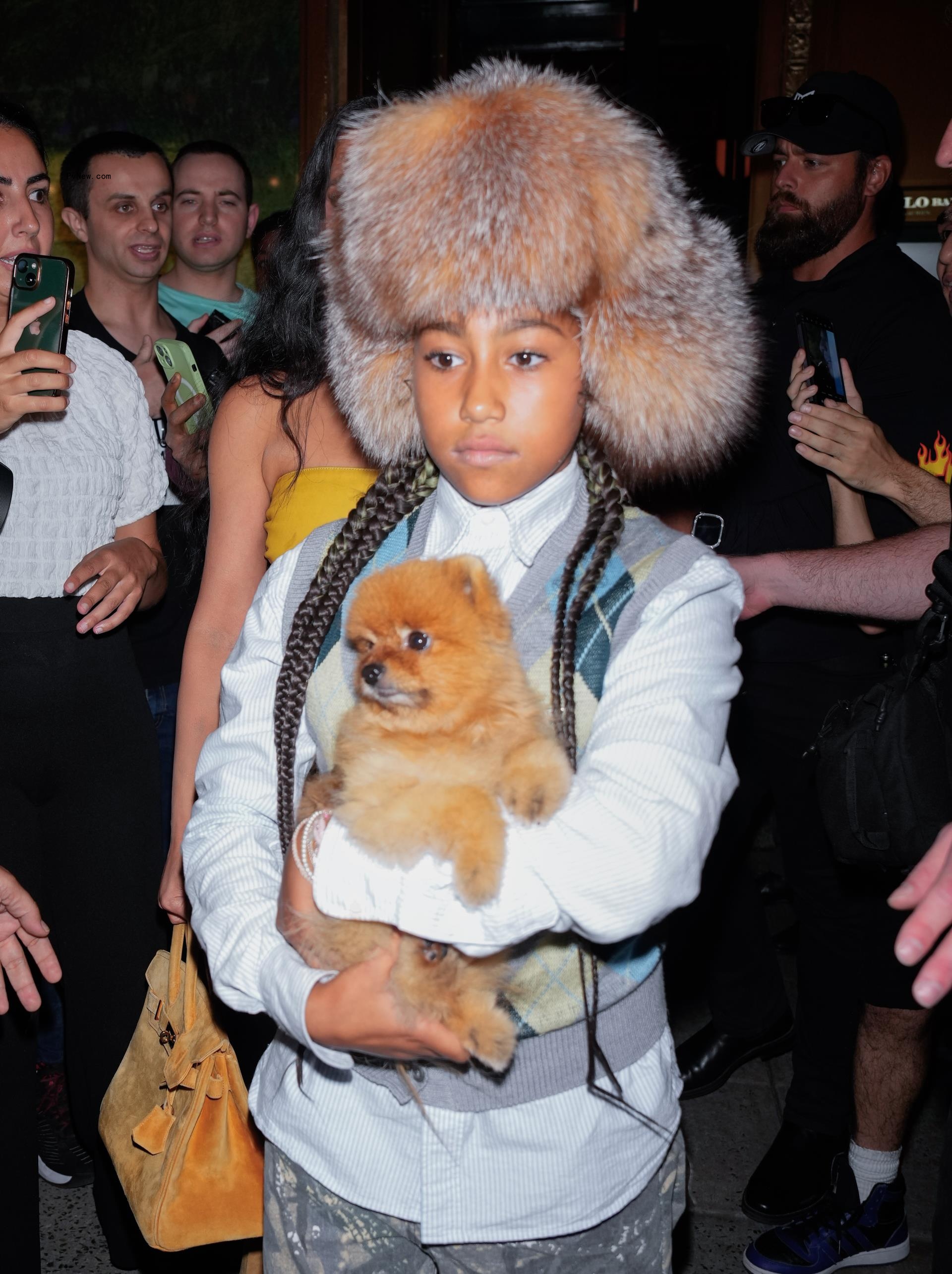 North West wearing Bianca Censori's fur hat while out in New York City