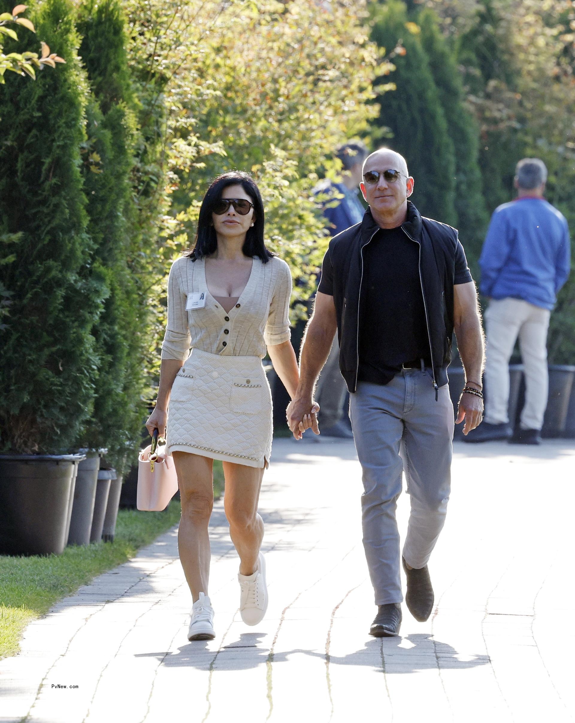 Jeff Bezos and Lauren Sánchez hold hands in July 2024 in Idaho