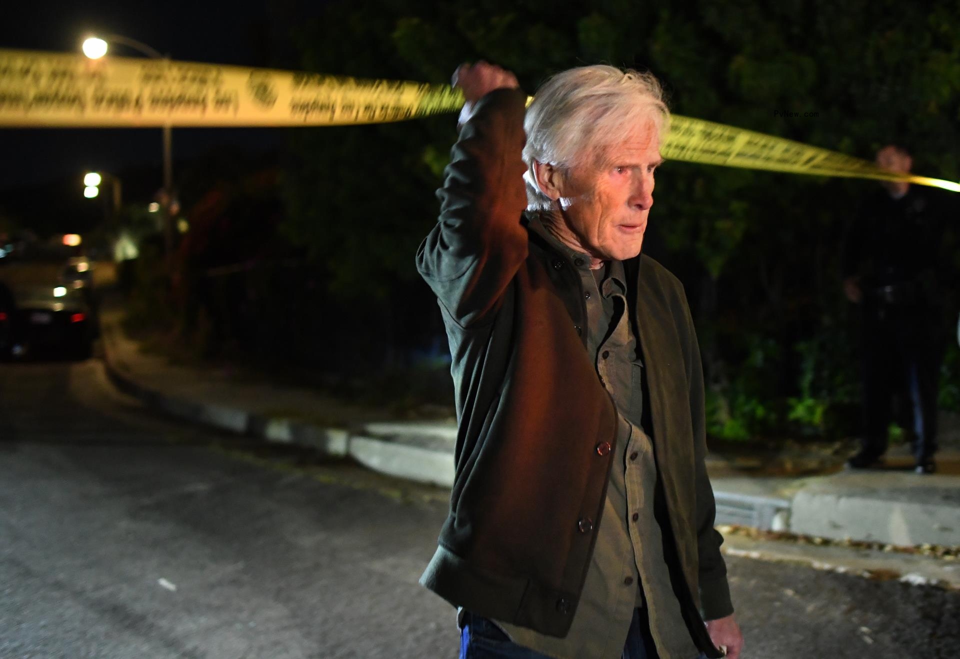 Keith Morrison crosses the police tape down the street from wher<i></i>e Matthew Perry's house in Pacific Palisades in October 2023.