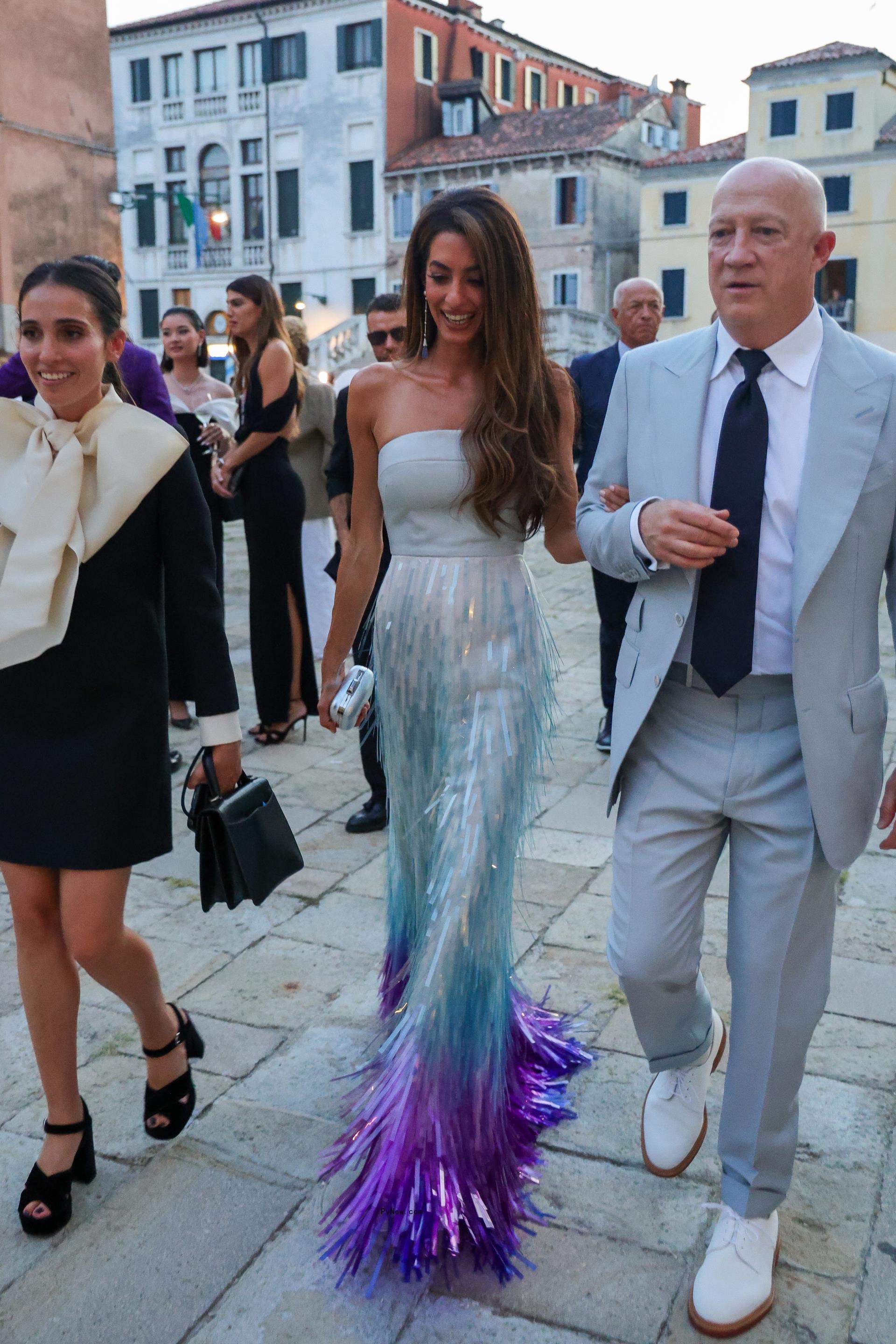 Amal Cloo<i></i>ney wearing a custom Bach Mai gown at a Cartier party during the Venice Film Festival