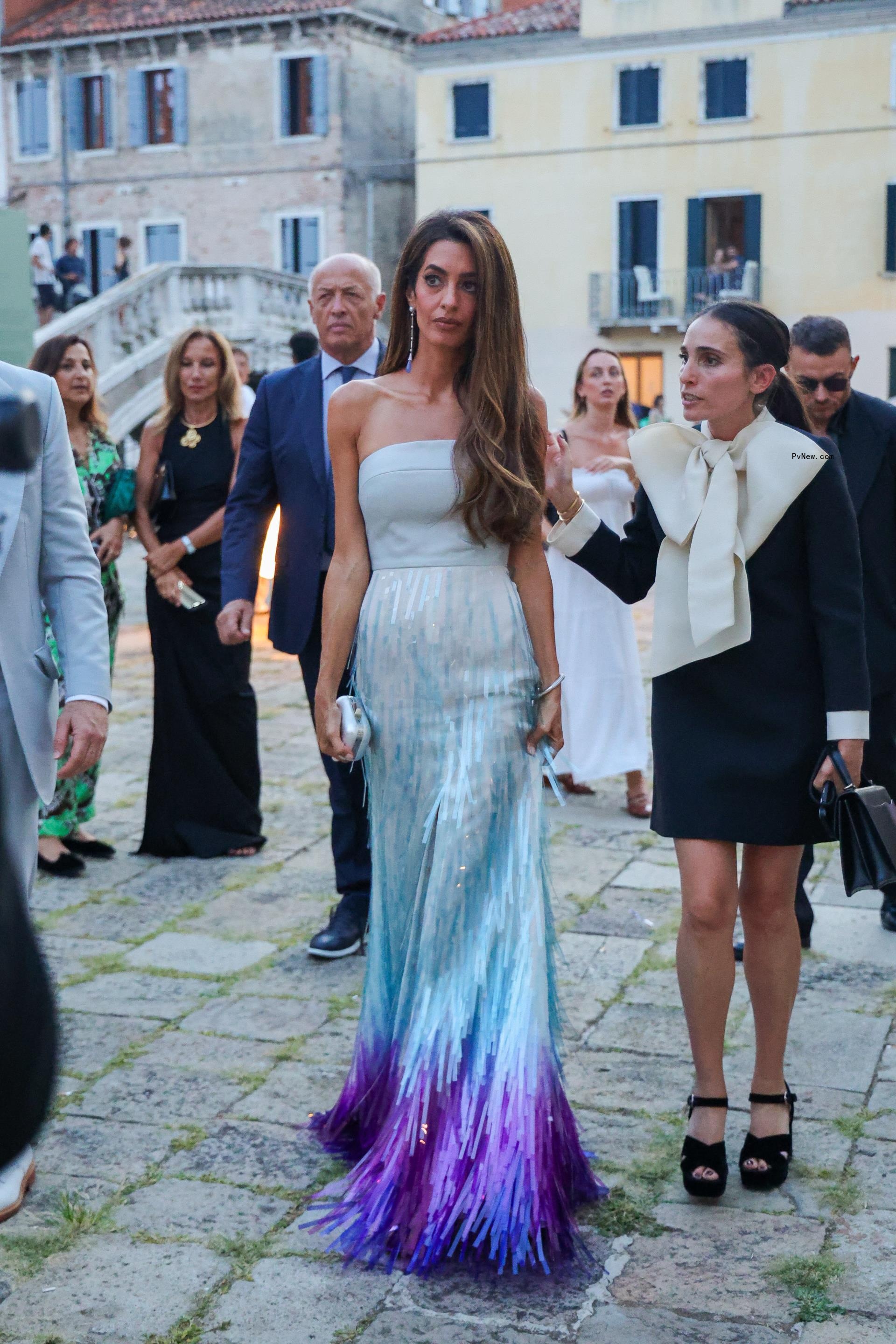 Amal Cloo<i></i>ney wearing a custom Bach Mai gown at a Cartier party during the Venice Film Festival