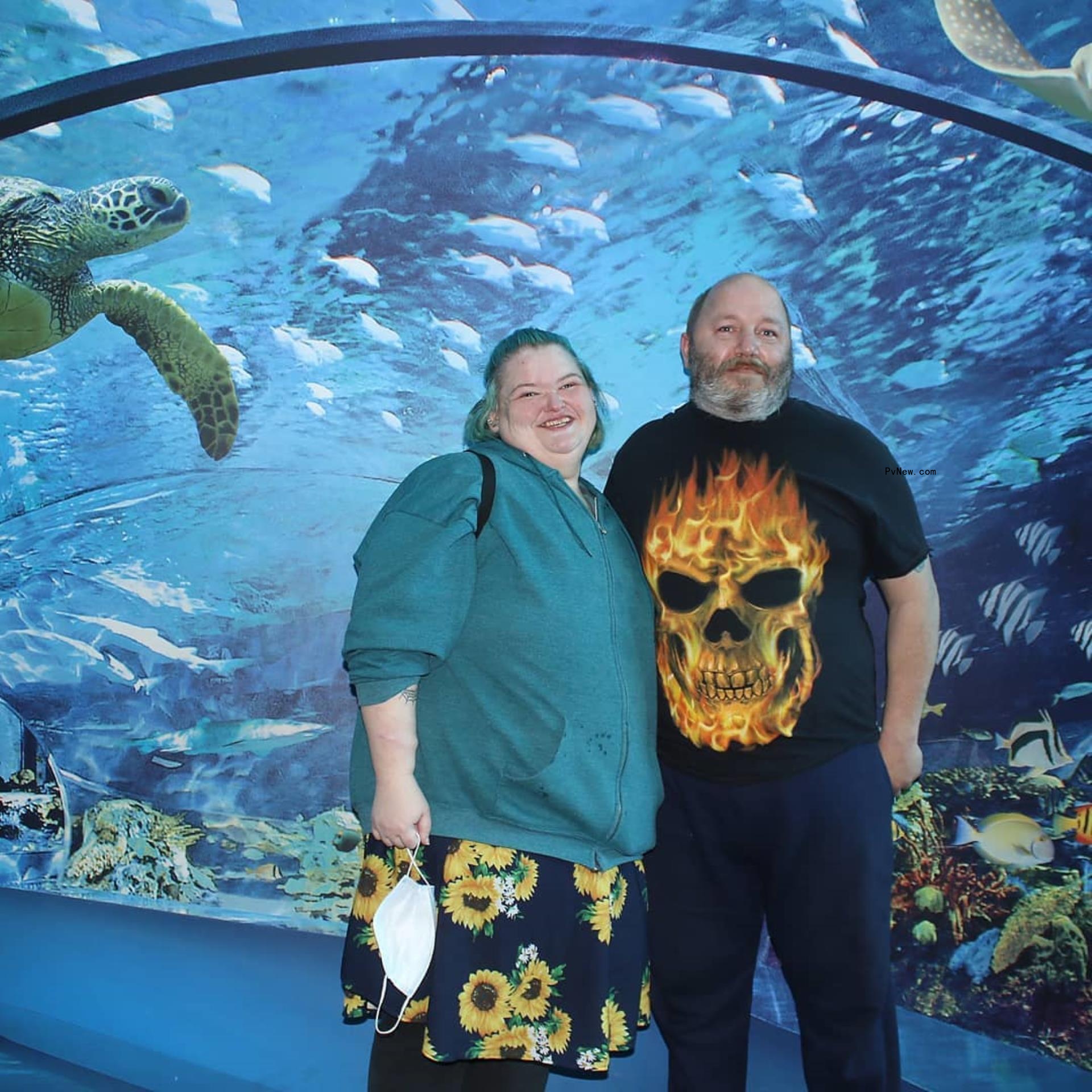 Amy Slaton and Michael Halterman at an aquarium. 