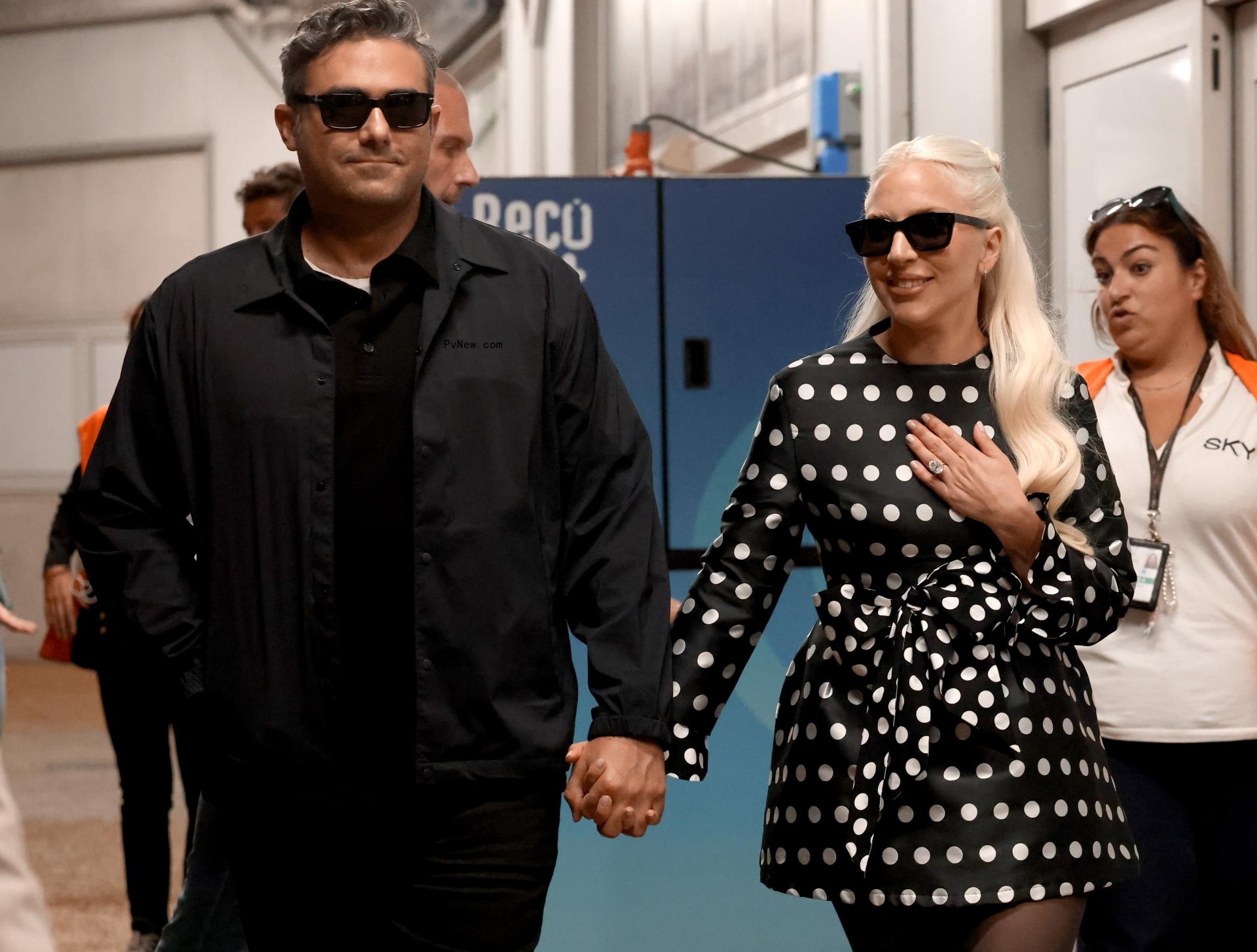 Lady Gaga and Michael Polansky holding hands at the 2024 Venice Internatio<i></i>nal Film Festival.