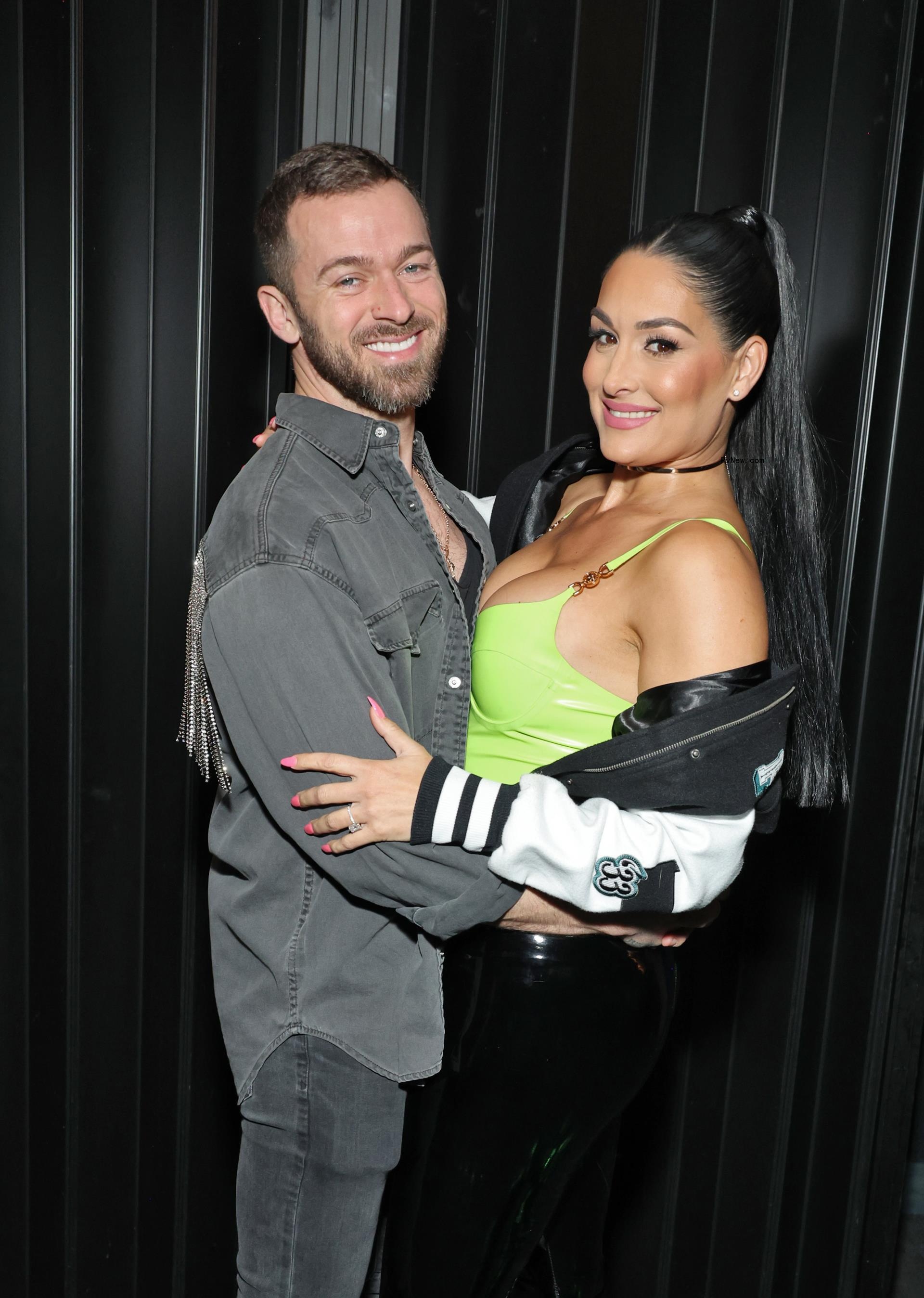 Artem Chigvintsev and Nikki Garcia attend Brie and Nikki Bella's live edition of SiriusXM's The Bellas Podcast on February 08, 2023 in Phoenix.