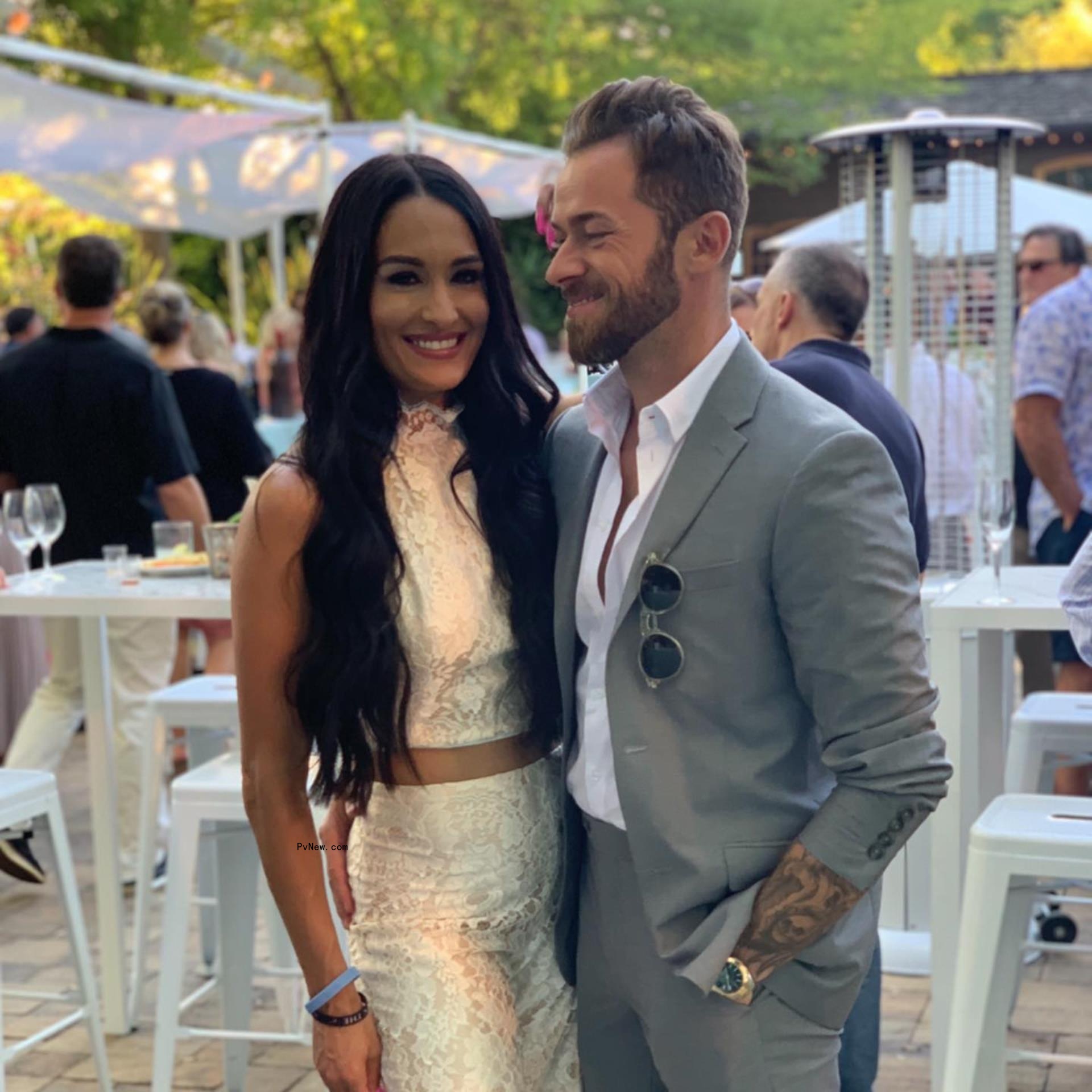 Artem Chigvintsev and Nikki Garcia take a photo together.