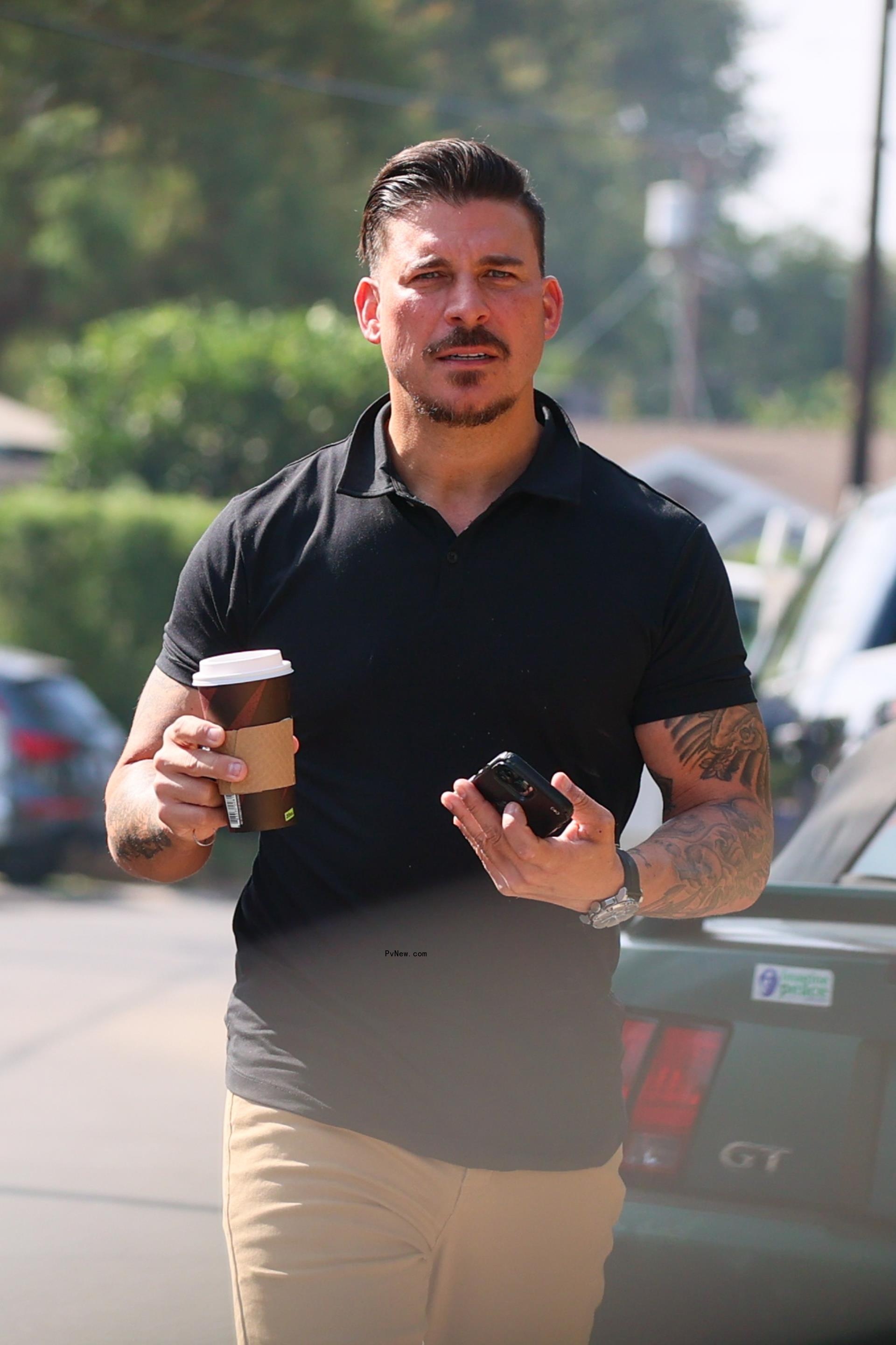 Jax Taylor holding a coffee in LA in August 2024