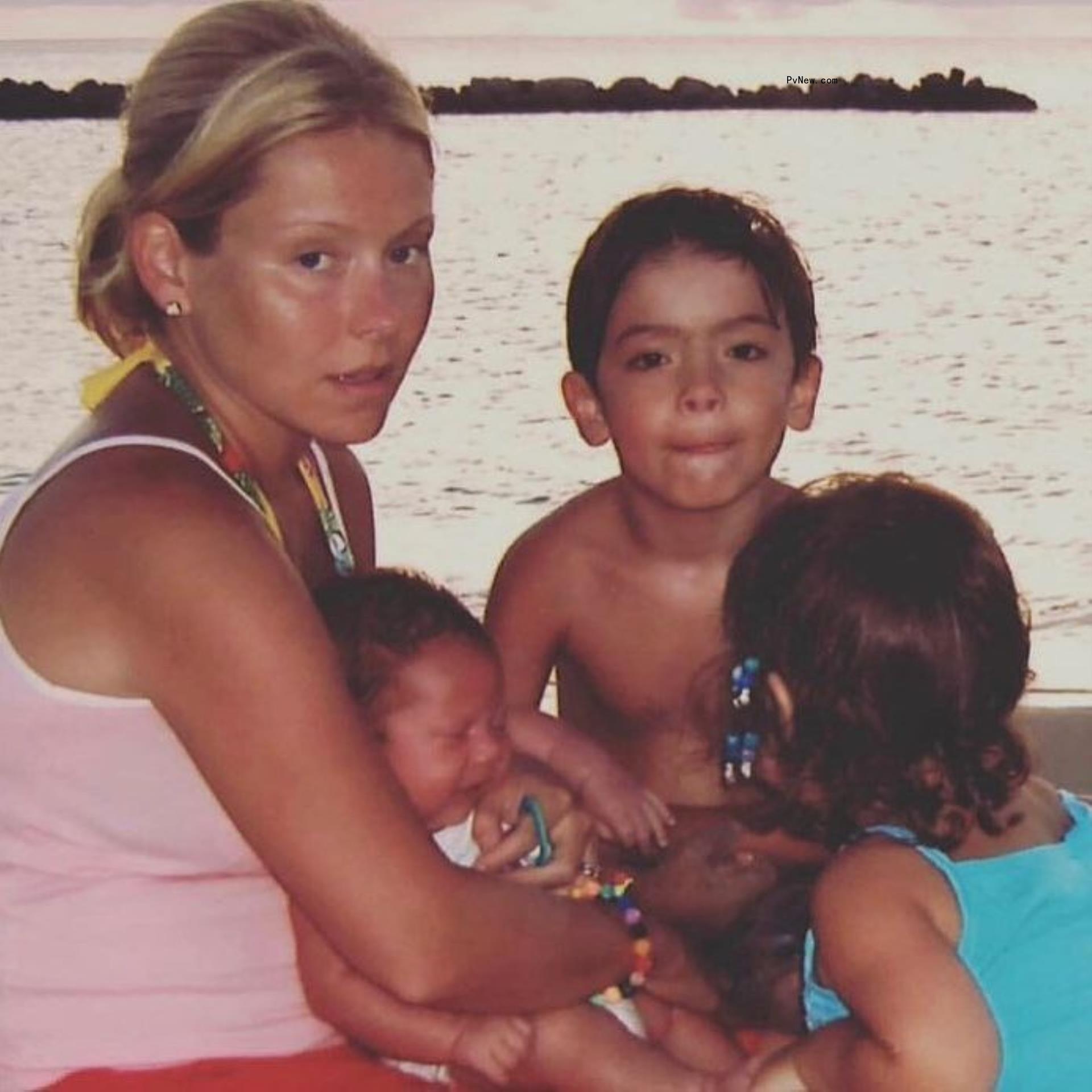 Kelly Ripa and her three kids on a lake when they were little