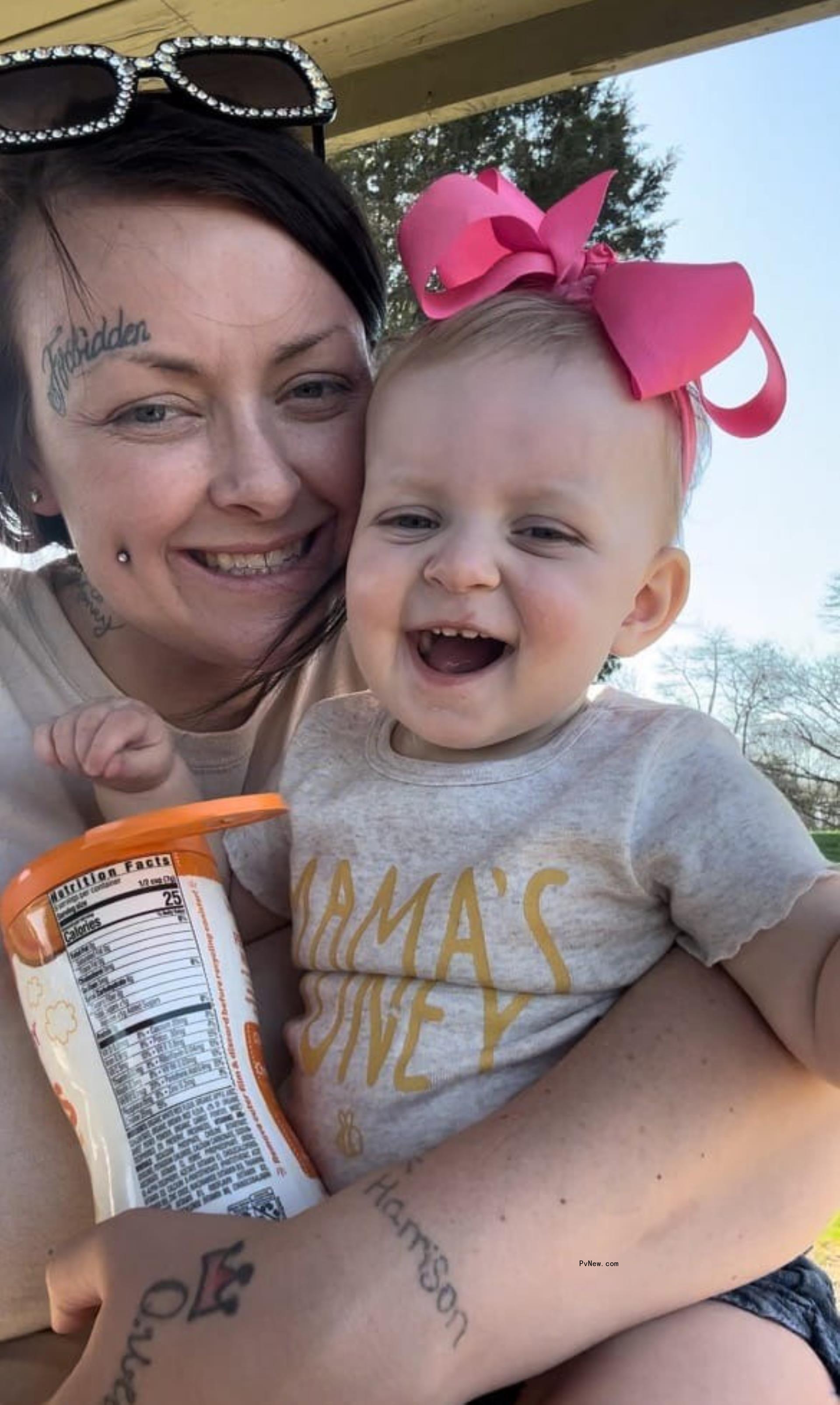 wyno<i></i>nna judd's daughter grace kelley holding her baby