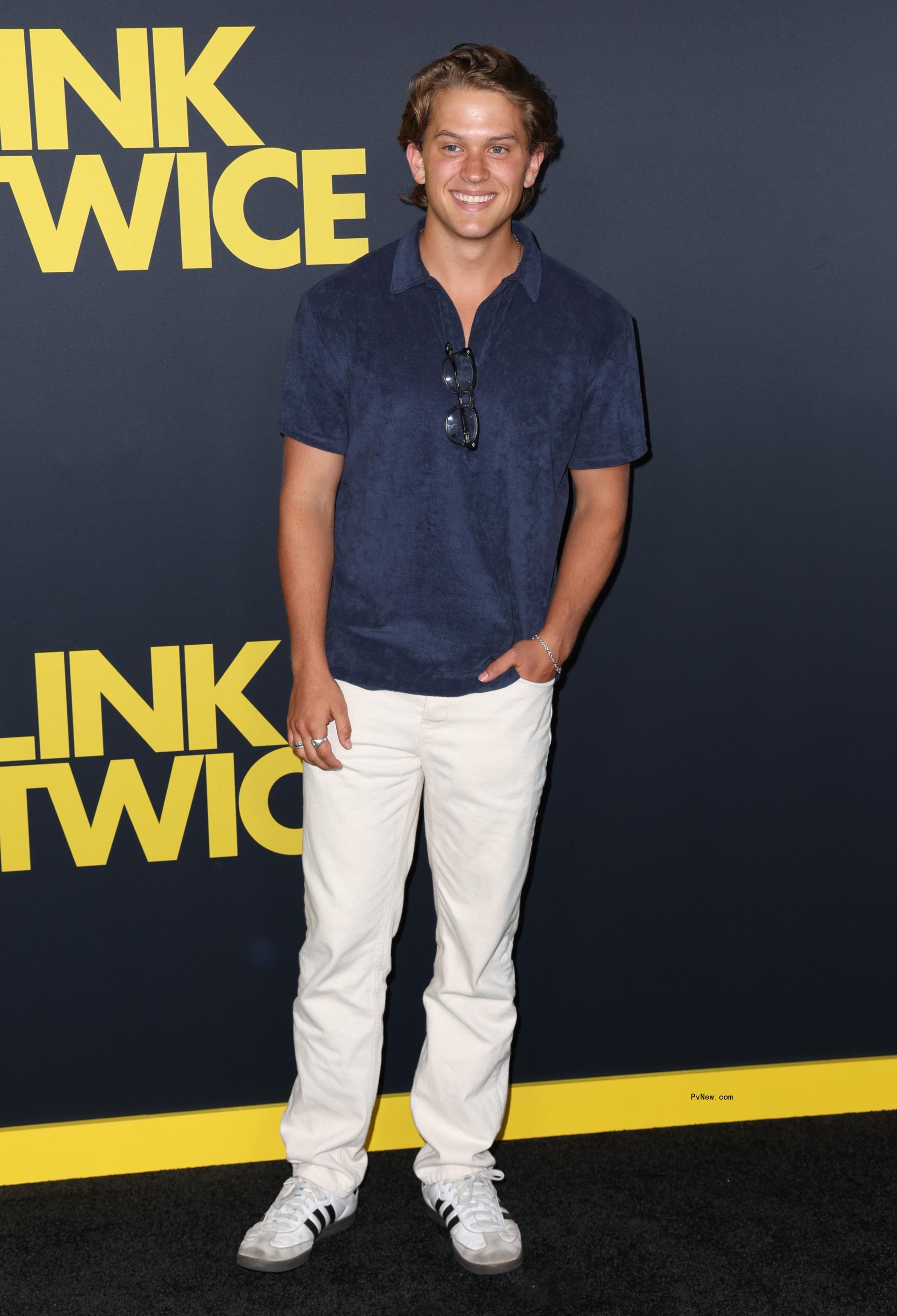 Reese Witherspoon's son wore a blue shirt and white pants to the 