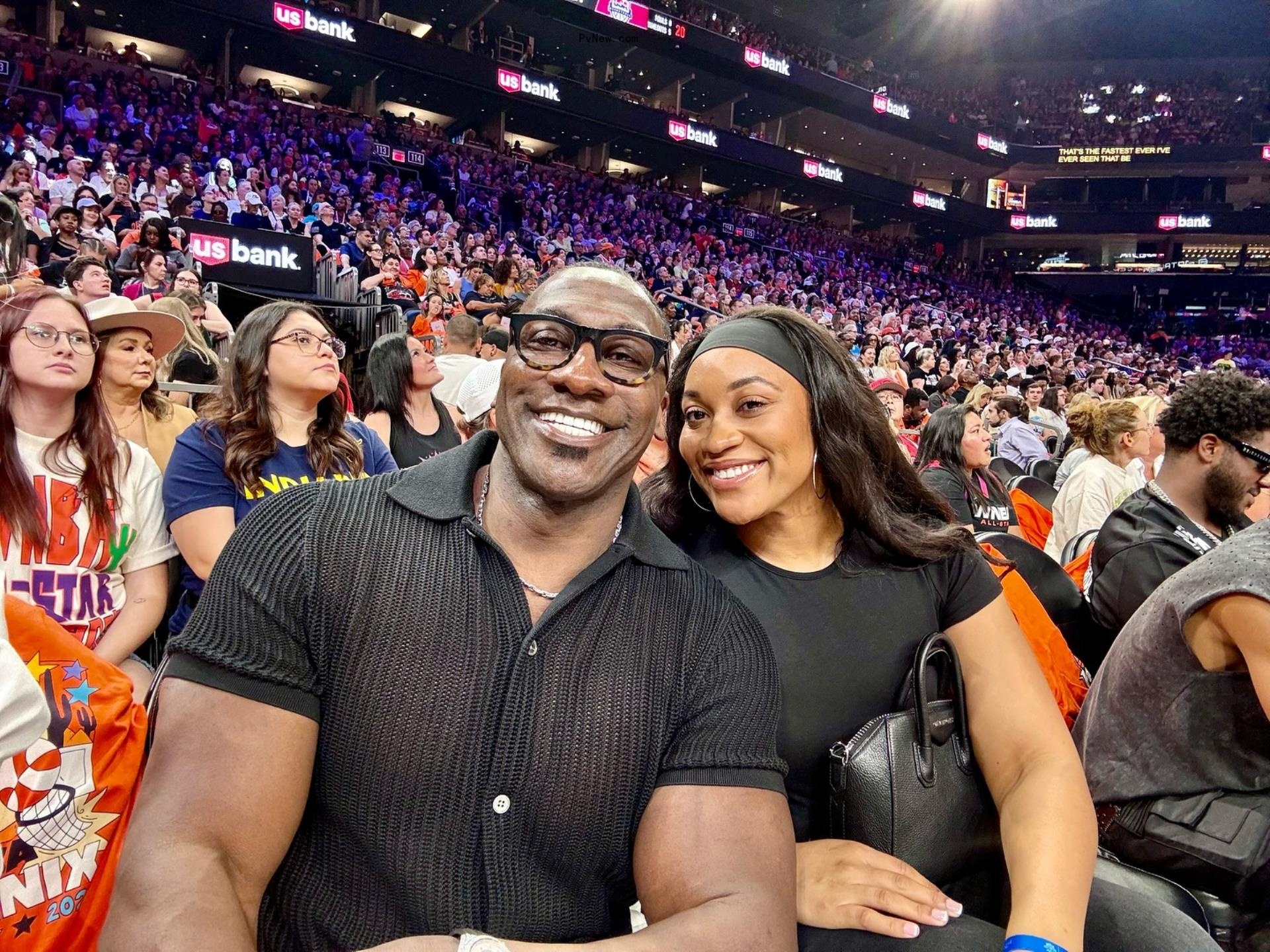 Shannon Sharpe and one of his daughters at an WNBA game.