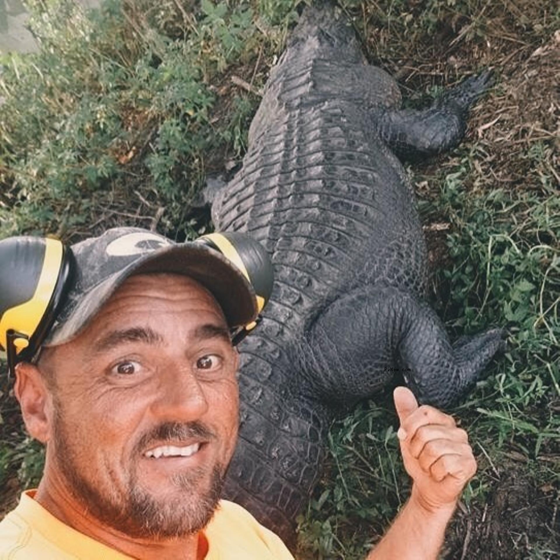 Jeremy Dufrene and an alligator.