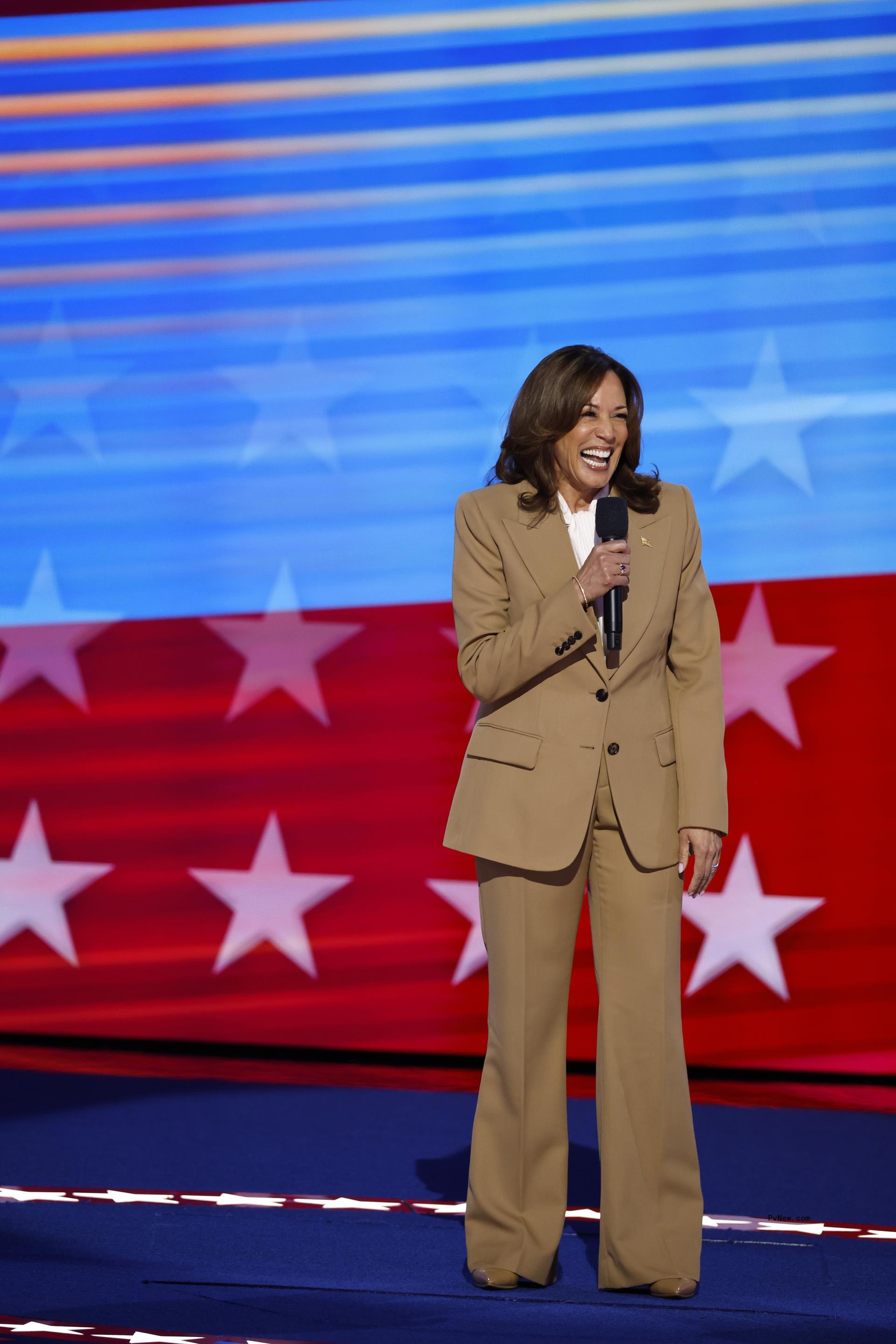 Kamal Harris in a tan suit at the 2024 DNC.