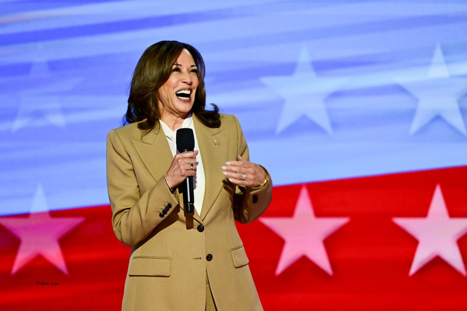 Kamala Harris at the 2024 DNC in a tan suit.