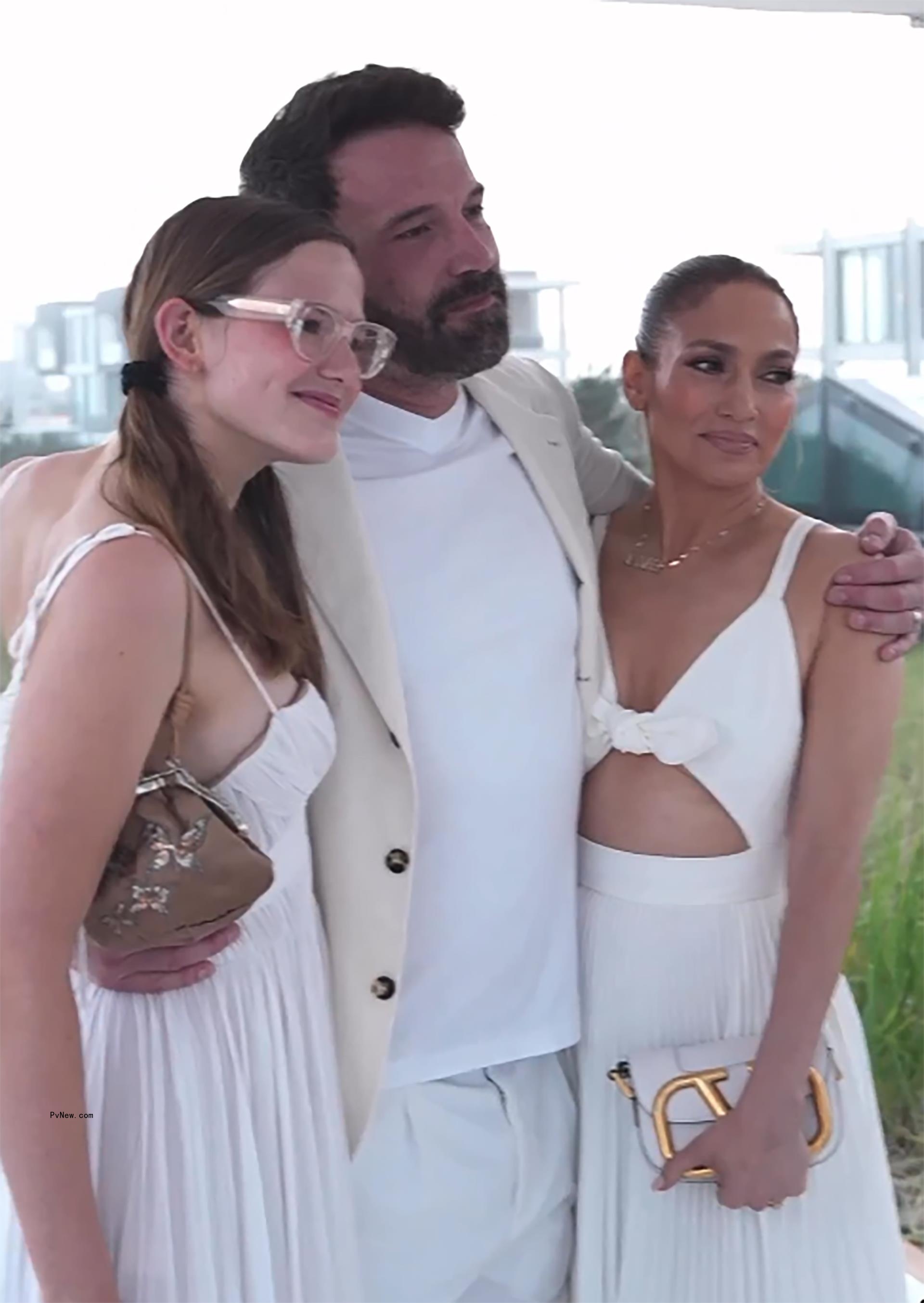 Jennifer Lopez, Ben Affleck, and Violet Affleck pose together.