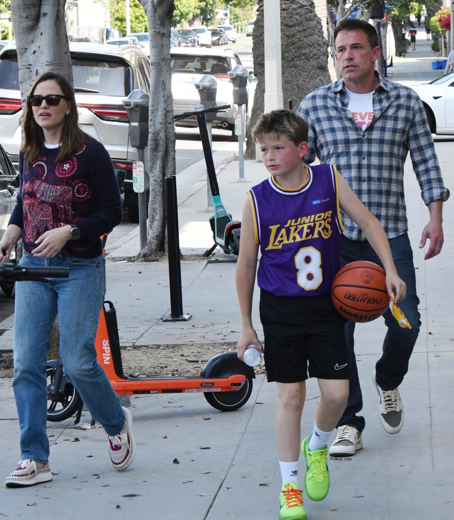 Ben Affleck and Jennifer Garner put on a united front as they leave their son Samuel's basketball game in Santa Mo<i></i>nica in June.