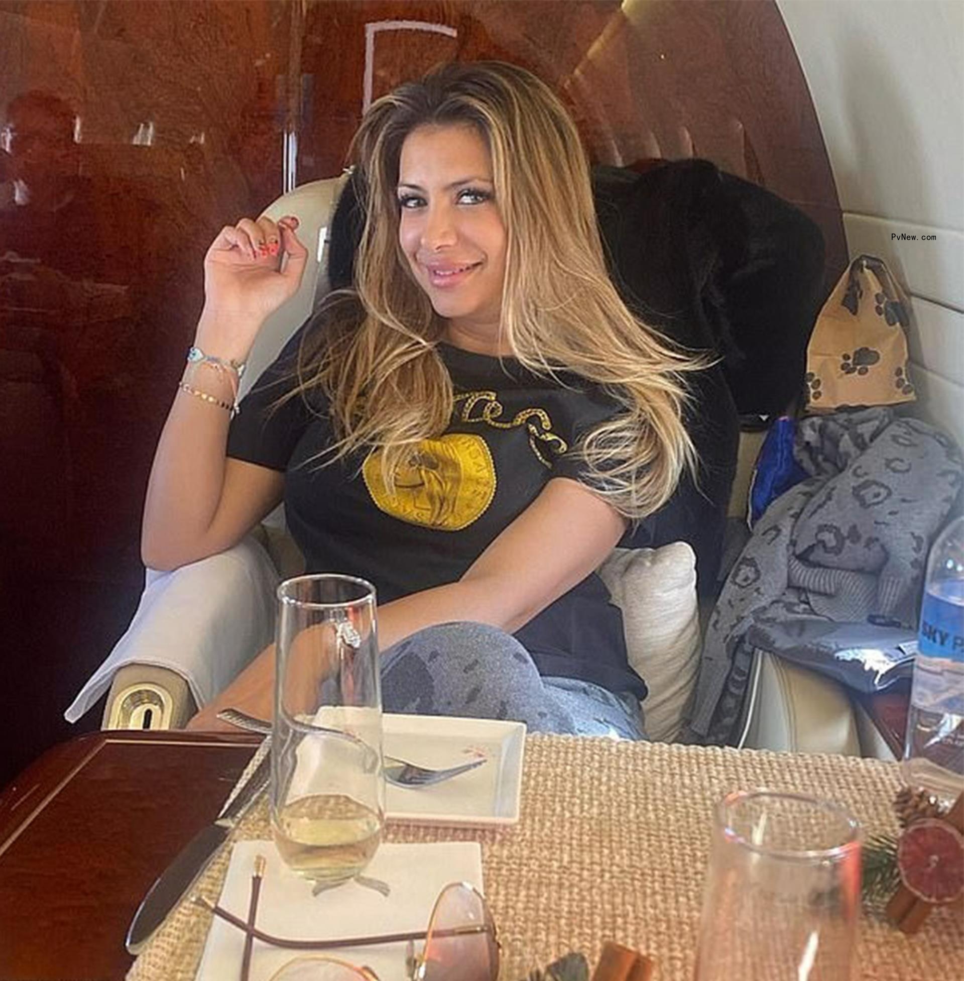 Jasveen Sangha lounging on a private jet